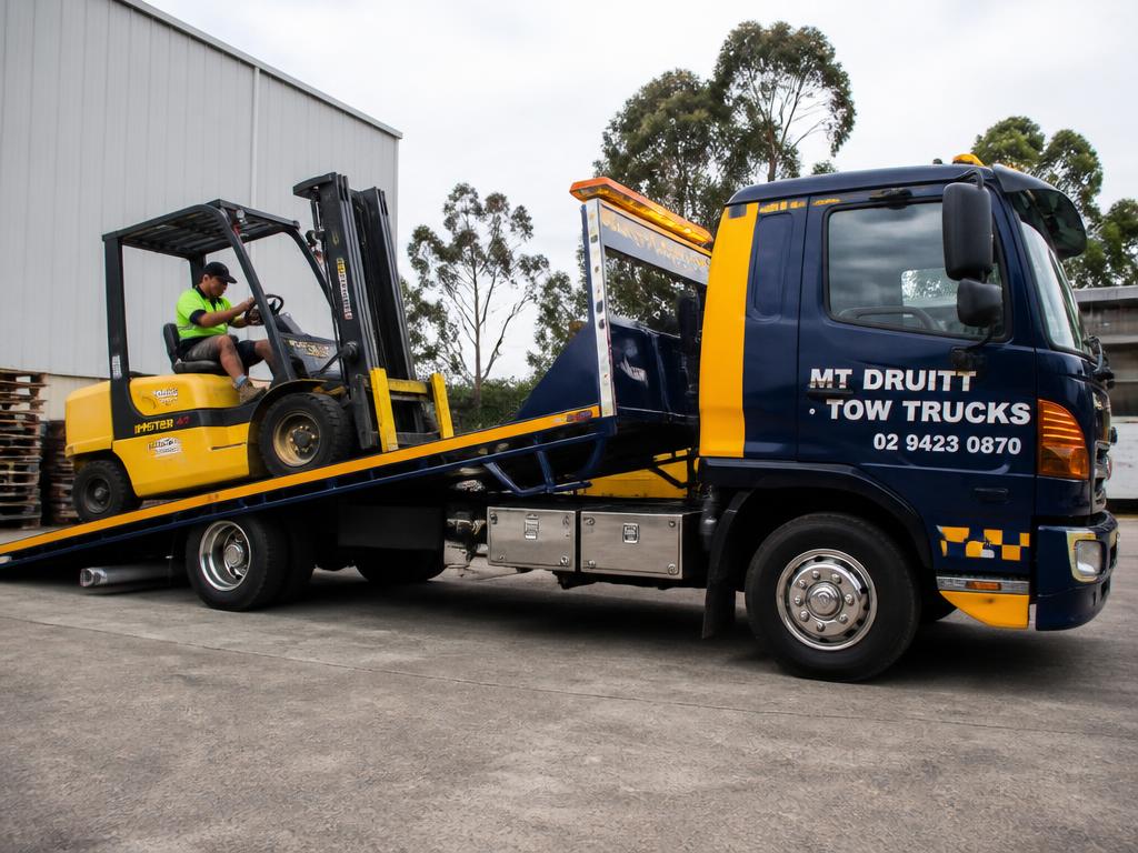 Forklift being loaded onto a Mt Druitt tow truck