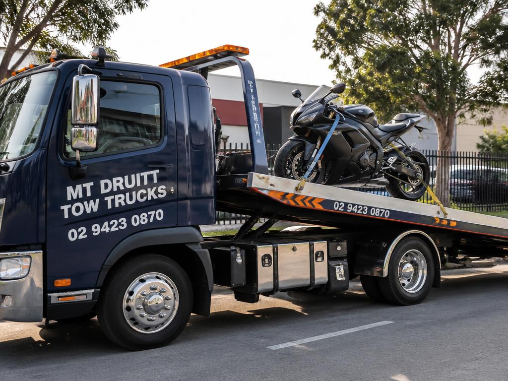 Motorbike secured on a Mt Druitt tow truck tray